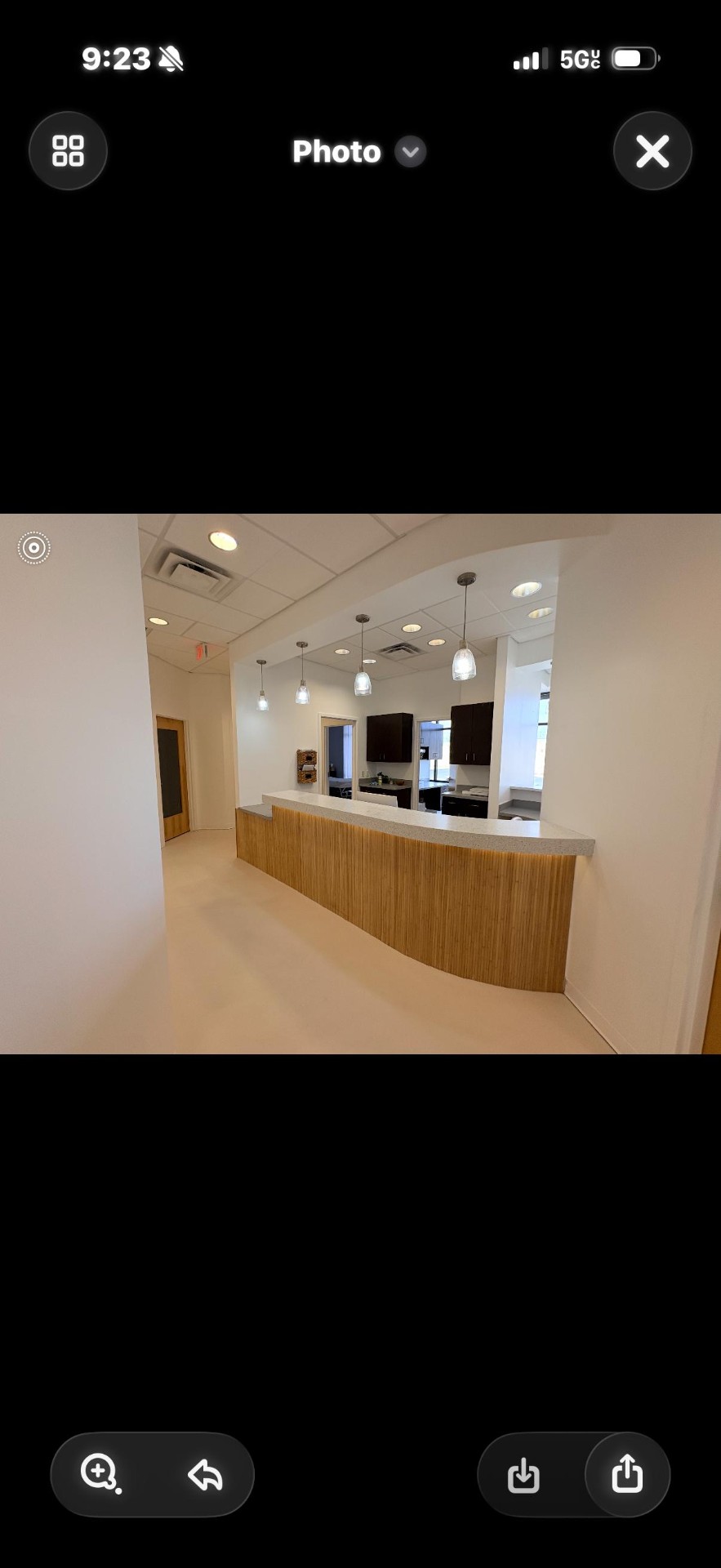 Curved wood reception desk at The Skin & Body Shop